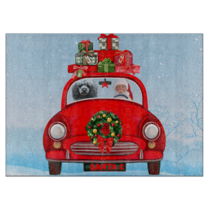 Poodelhond in auto met kerstman snijplank