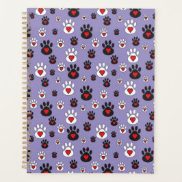 Pootafdrukken met rode harten op blauw planner