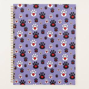 Pootafdrukken met rode harten op blauw planner