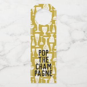 POP DE CHAMPAGNE Wit op Gouden Wijnbril Flessenhanger
