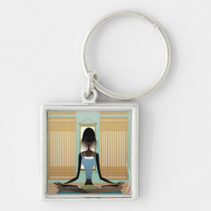 Portret van jonge vrouw die yoga doet sleutelhanger
