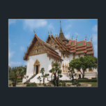 Postcard of a scenic temple in Thailand Briefkaart<br><div class="desc">Photo of a dazzling white temple under a blue sky. The temple,  in the heart of Thailand,  has gold trimmings and traditional Thai architecture  It is surrounded by trees. Stairs lead to one of the entrances. The roof is red and Thai art adorns the outside of the temple.</div>