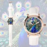 Prachtige pauw met blauwgroen en gouden verenkleed horloge<br><div class="desc">Dit horloge heeft een prachtig pauwenontwerp in prachtige blauwgroen,  koningsblauwe en gouden kleuren. Romantisch en elegant motief. Perfect en personaliseerbaar cadeau voor elke gelegenheid.</div>