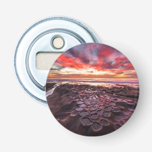 Prachtige zonsondergang bij de getijdenpoelen button flesopener