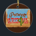 Prescott Arizona Cartoon Desert Vintage Travel Keramisch Ornament<br><div class="desc">Druk op Arizona neo vintage in een grappige cartoon retro-stijl met de woestijn,  een cactus en rotsen. Blauw,  bruin en rood met groene cactus.</div>