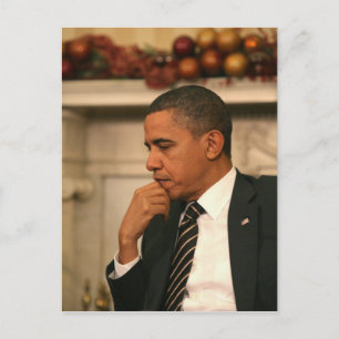 President Barack Obama overpeinst terwijl hij Briefkaart