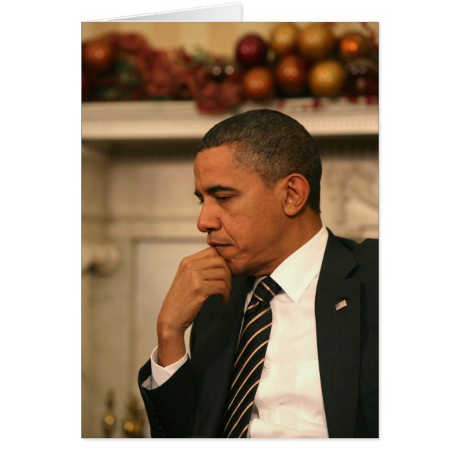 President Barack Obama reflecteert terwijl hij (Voorkant)