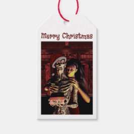 Prettig kerstfeest. Grappig skelet met vrouw Cadeaulabel