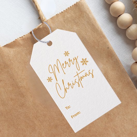 Prettig kerstfeest groet goud cadeaulabel