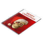 Prettig kerstfeest. Schedel met kerstmuts Notitieboek (Linkerzijde)