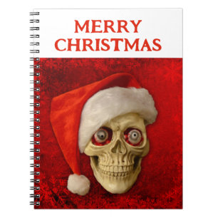 Prettig kerstfeest. Schedel met kerstmuts Notitieboek