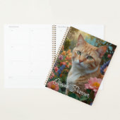 Pretty white orange cat in floral garden planner (Display)