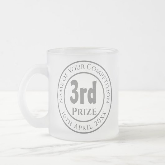 Prijs voor de wedstrijd 3de prijs matglas koffiemok (Links)