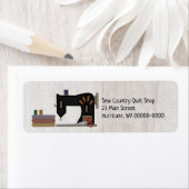 Primitief landelijk naaiwerk met kantelend terugke etiket (Insitu)