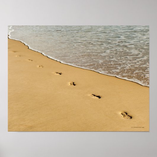 Prints in zand met golven (Voorkant)