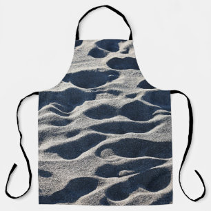 Prints met voet op zand overdag schort
