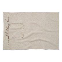 Prints op blote voeten in strandzand