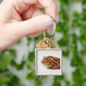 Profiel van de paardenkikker sleutelhanger (Hand)