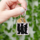 Profiel van een man dat danst met vrouwen in een n sleutelhanger (Hand)