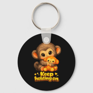 Punch aap met teddybeer knuffelen blijft vasthoude sleutelhanger