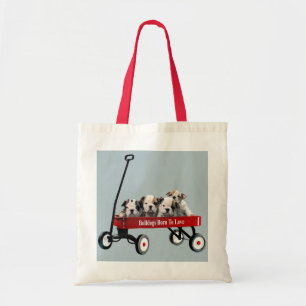 Puppies van bulledog in de Canvas tas van Wagon