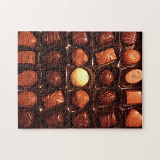Puzzel die doos van chocoladesnoep kenmerken legpuzzel (Horizontaal)