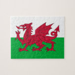 Puzzel met vlag van Wales Legpuzzel<br><div class="desc">Ga op een puzzel avontuur terwijl het vieren van Welsh erfgoed met onze boeiende puzzel met de vlag van Wales. Gemaakt met precisie en aandacht voor detail, is deze puzzel niet alleen een leuke activiteit, maar ook een eerbetoon aan de rijke cultuur en geschiedenis van Wales. Dompel jezelf onder in...</div>