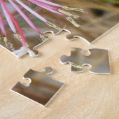 Puzzel - Roze bloemen in gedroogd gras Legpuzzel (Zijkant)