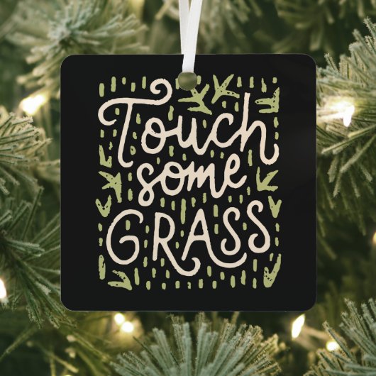 Raak wat gras zwart en groen aan metalen ornament (Insitu)