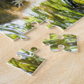 Raccoon zwemmen in rivierwater legpuzzel (Zijkant)