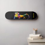 Rainbow Colored Cartoon Chameleon Personalized Persoonlijk Skateboard<br><div class="desc">Dit skateboard is klaar om met een naam of andere douanetekst worden gepersonaliseerd. Het is voorzien van een helder gekleurde cartoon illustratie van een chameleon tegen een zwarte achtergrond met jouw tekst in vetgedrukte groene letters.</div>