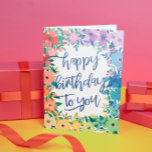 Rainbow Flowers Brush Script Happy Birthday Kaart<br><div class="desc">De regenboog kleurde gelukkige verjaardagskaart met een lijst bloemen in rood,  oranje,  geel,  groen,  blauw,  en paars met gelukkige verjaardag aan u geschreven in een charmante blauw borstelmanuscript.</div>