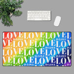 Rainbow LGBT Gay Pride Bureaumat<br><div class="desc">Deze kleurrijke bureaumat is versierd met een waterverf regenboog achtergrond en een Love is Love-patroon in stijlvolle witte typografie.</div>