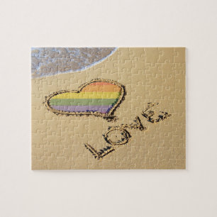 Rainbow-liefdeshart van de homo's in het zand legpuzzel