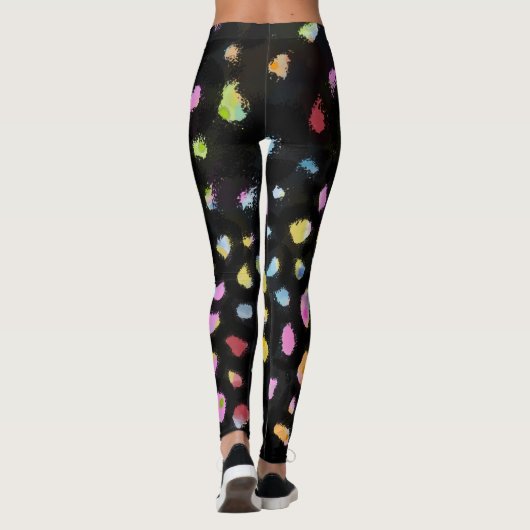 Rainbow Splash-ontwerp op zwarte achtergrond Leggings (Achterkant)