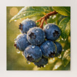 Raindrops on Ripe Blueberries Legpuzzel<br><div class="desc">Ripe blueberries hang from a branch, adorned with dewdrops, while the sunlight casts a warm glow around their vibrant blue hue</div>