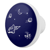 Raket in buitenruimte op donkerblauwe keramische k knop (Rechts)