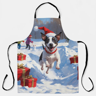 Rat Terrier rent in de sneeuw met kerstmuts Schort