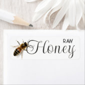 Rauwe lokale honing met levensgrote honingbij op w etiket (Insitu)