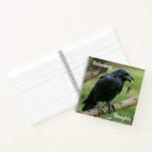 Raven op een tak met sleutel notitieboek (Binnen)