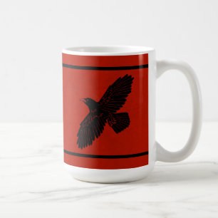 Raven op rood koffiemok