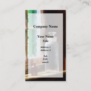 Reagens flesje en kleine bruine flesje visitekaartje