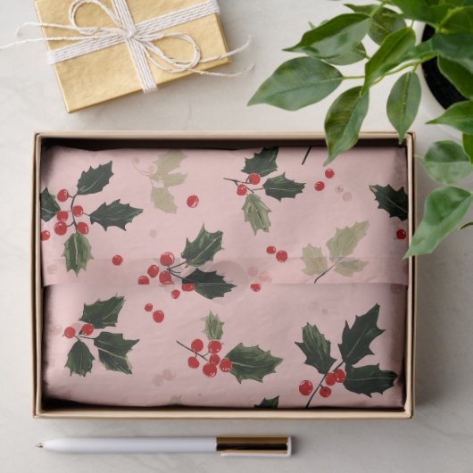 Red berries and holly on pink tissuepapier (Geschenk)