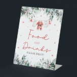 Red Christmas Santa Baby shower Eten en Drinken Reclamebord Met Voetstuk<br><div class="desc">Het Red Santa Gender Neutral Santa Baby Clothes Christmas Red Christmas Santa Baby shower Eten en Drinken teken voegt een feestelijke en uitnodigende touch aan uw vakantie-thema baby shower. Met een vrolijk rood ontwerp met delicate sneeuwvlokken, seizoensgebonden eucalyptusgroen en schattige op de kerstman geïnspireerde babykleding, leidt dit bord gasten hartelijk...</div>