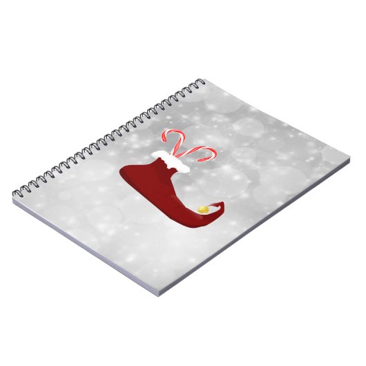 Red Elf Shoe met snoepjes op Bokeh-achtergrond Notitieboek (Linkerzijde)