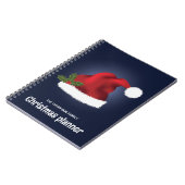 Red Festive Santa Hat op blauw met aangepaste teks Notitieboek (Linkerzijde)