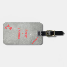 Red graffiti name on gray concrete, your bagagelabel