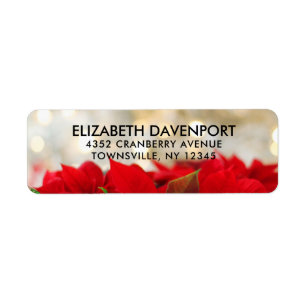 Red Poinsettias met Golden Bokeh Kerstmis Etiket