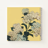 Red winged Blackbird flying among flowers yellow Notitieboek (Achterkant)