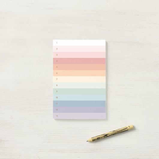 Regenboogstaven genummerd post-it® notes (Op bureau)